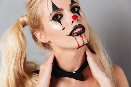 Close-up image of young blonde woman in halloween make up