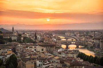 Fototapeta na wymiar Aerial view of Florence at sunset with the Ponte Vecchio and the Arno river, Tuscany, Italy