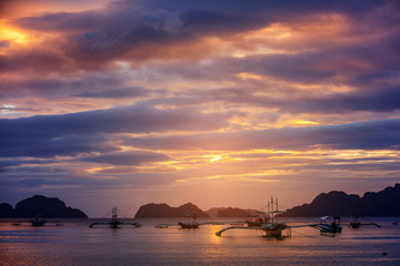 Beautiful sunset with fishing boats