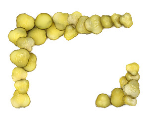 Frame made of pickled cucumber slices on white background