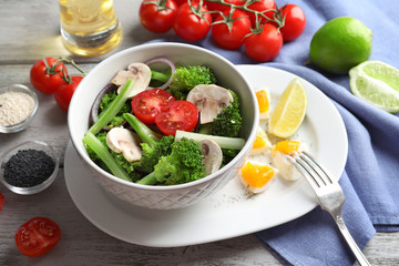 Dish with broccoli salad on table