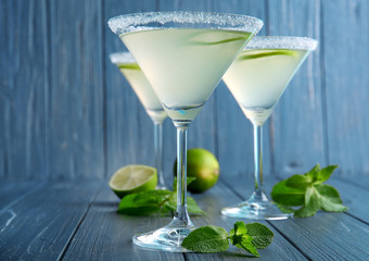 Glasses of lemon drop martini on wooden table