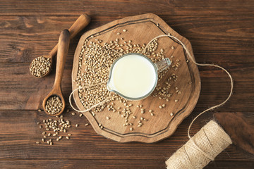 Composition with healthy hemp milk on wooden background