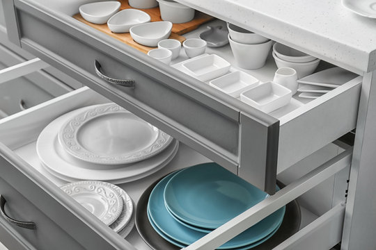 Set Of Tableware In Kitchen Drawers