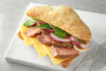 Steak sandwich on stone board