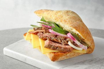 Steak sandwich on stone board