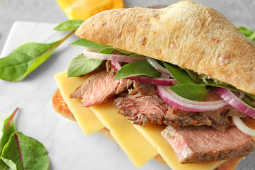 Steak sandwich on stone board