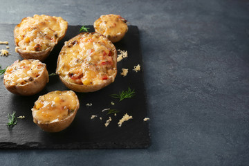 Stuffed potatoes on slate plate