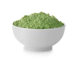 Wheat grass powder in ceramic bowl on white background