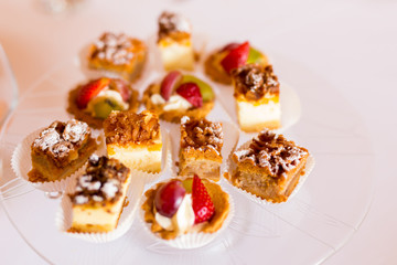Variety of cakes on a glass plate.
