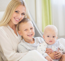 Portrait of happy mother with two sons