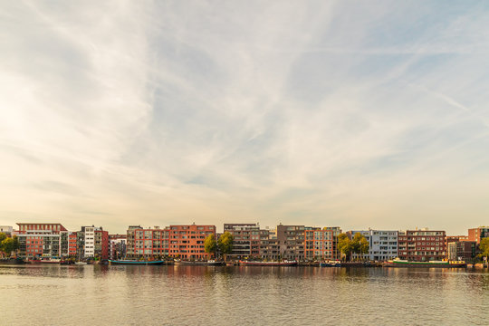 Contemporary apartment buildings and houseboats in Amsterdam