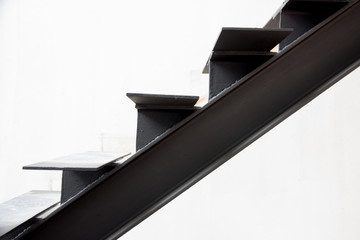 Installation of steel stairs using steel i-beams.