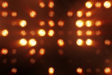 The wall of incandescent lamps is bright orange. LED background