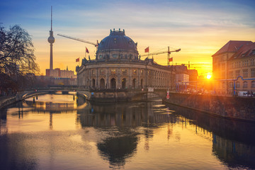 Museum Island on Spree river and TV tower in the background at sunrise, Berlin, Germany