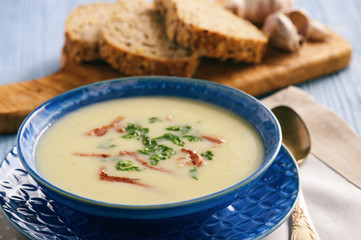 Homemade garlic cream soup with bacon.
