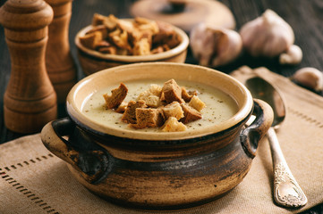 Homemade garlic cream soup with croutons.