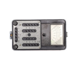 Old retro multimeter isolated on white background. Obsolete technologies.