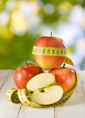 image of apple and centimeter on the table