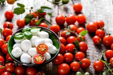 Basil, tomatoes and mozzarella for caprese salad, italian food and mediterranean diet concept