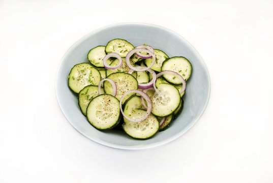 
Cucumber salad with red onion and ground pepper.