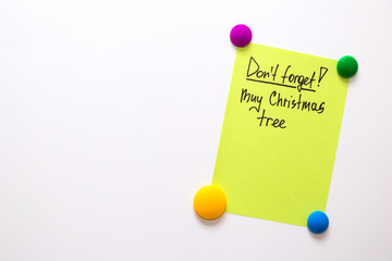 Fridge note with the text: Don't forget! Buy christmas tree