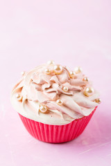 Pink cupcake decorated with beads