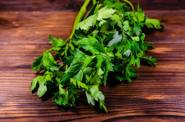 Bunch of parsley and dill on wooden table