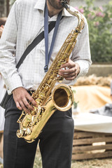 a man plays the saxophone