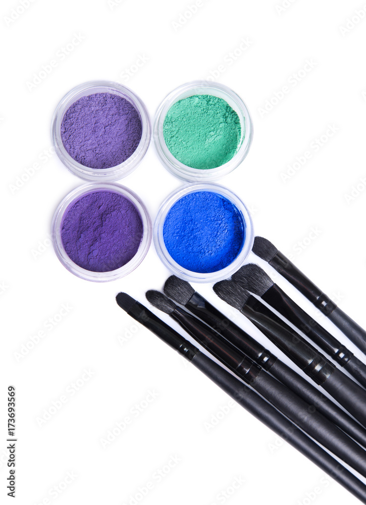 Wall mural Set of bright mineral eye shadows and makeup brushes