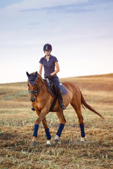 woman riding a horse. Equestrian sportswoman jockey