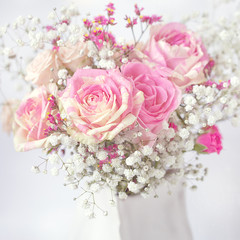 Lovely bunch of flowers .Close-up floral composition with a pink roses .Beautiful fresh pink roses on a table. 