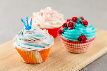 Three colorful cupcakes