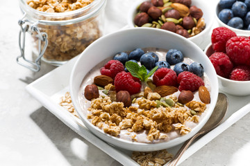 homemade muesli with yogurt and berries for breakfast