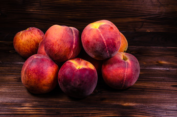 Fresh ripe peaches on wooden table