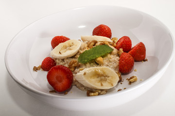 healthy porridge, scottish breakfast with strawberries and banana