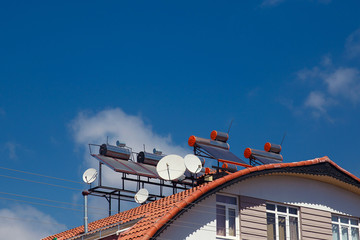 Contemporary hot water panels on a house, solar heater for green energy