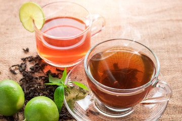 cup of tea with lemon slice on wood table