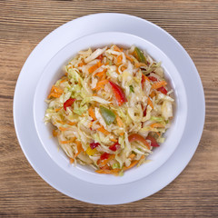Ukrainian and Russian dishes - homemade marinated, sour cabbage with carrots and onions, close up