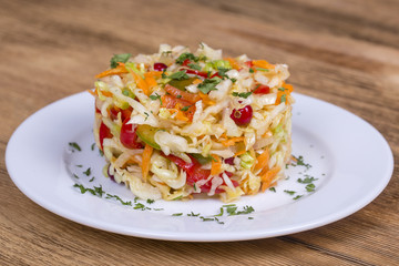 Ukrainian and Russian dishes - homemade marinated, sour cabbage with carrots and onions, close up