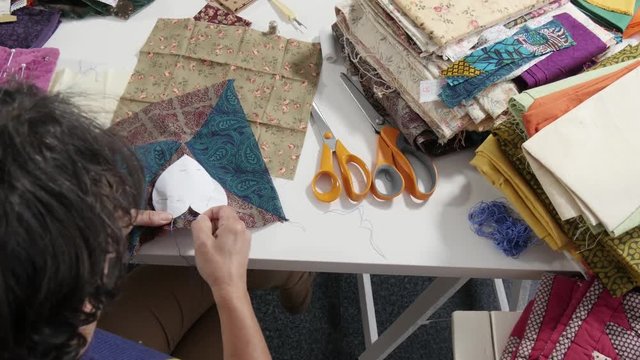 woman sewing patchwork