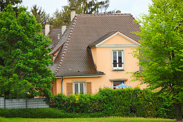 Two-storey house among the trees