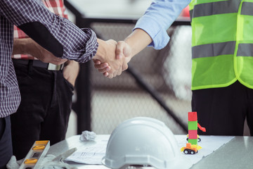 Team Business Partners Giving Fist Bump to Greeting Start up project with Contractor. Corporate Teamwork Partnership in an Office Meeting. Man with Hands together. Industry Business Concept.