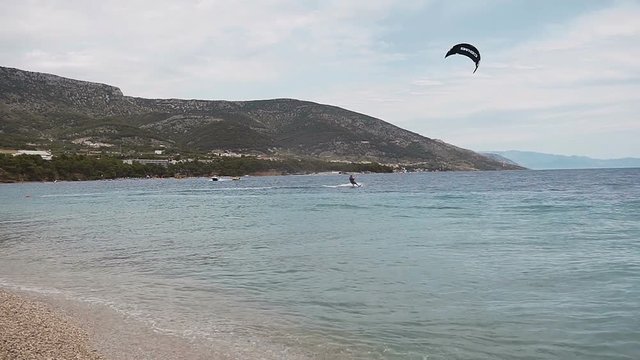 Kite surfer rides on the waves of the Adriatic Sea. Croatian