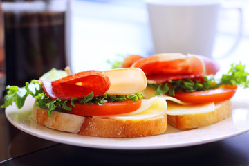 Breakfast with sandwich and coffee