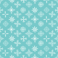 Hand drawn winter seamless patterns with snowflakes