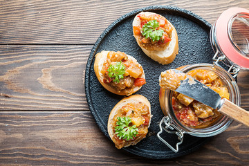 Bread toasts with eggplant caviar.