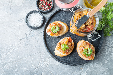 Bread toasts with eggplant caviar.