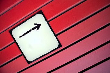Arrow sign on a wall