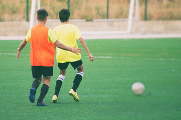 Obraz premium Unrecognizable players on the football field. Training.